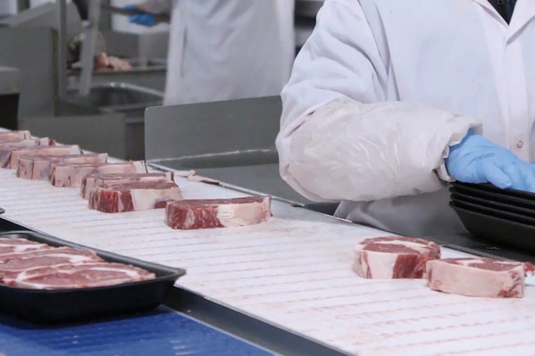 This is a photo of food on a conveyor belt.