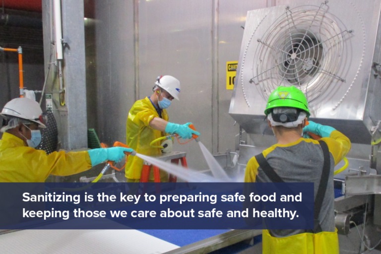 This is a photo of workers sanitizing an area.